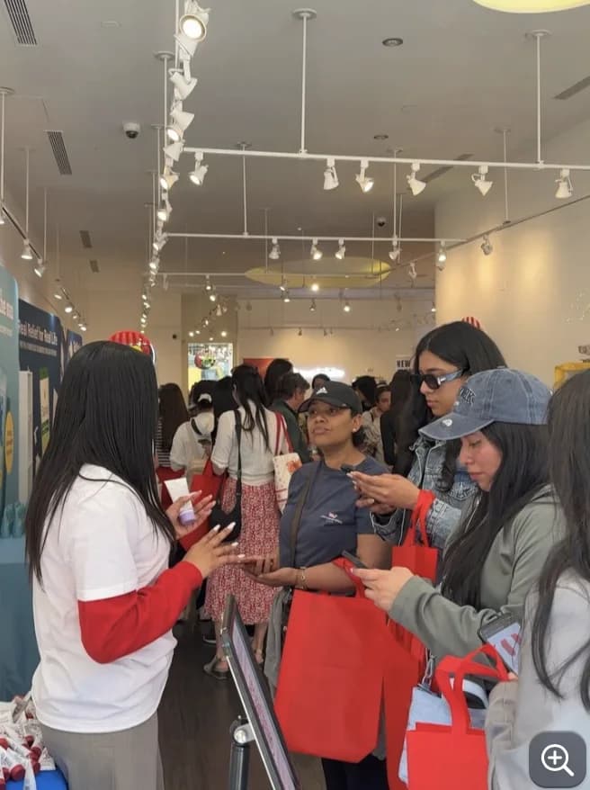 Guests sampling products inside the Herbacin SoHo pop-up shop