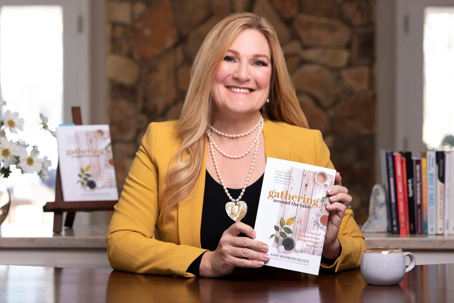 Kari Warberg Block with her book, Gathering Around the Table