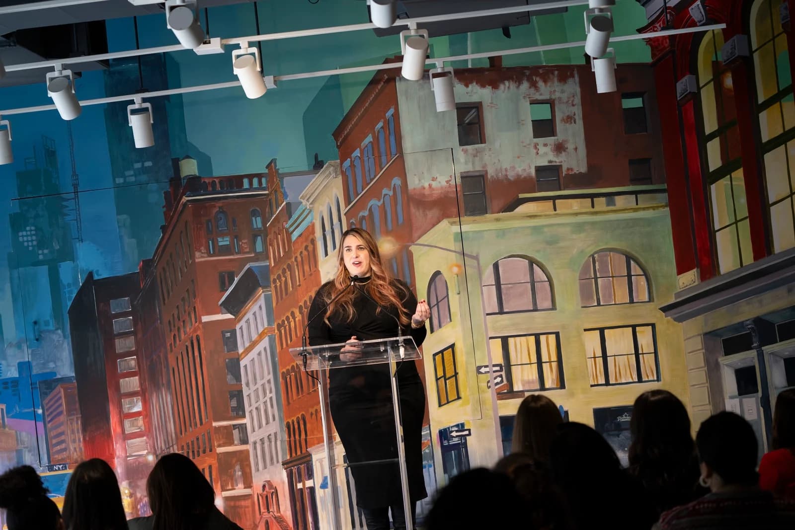 A Neuro Navigators speaker on stage at 7 World Trade Center